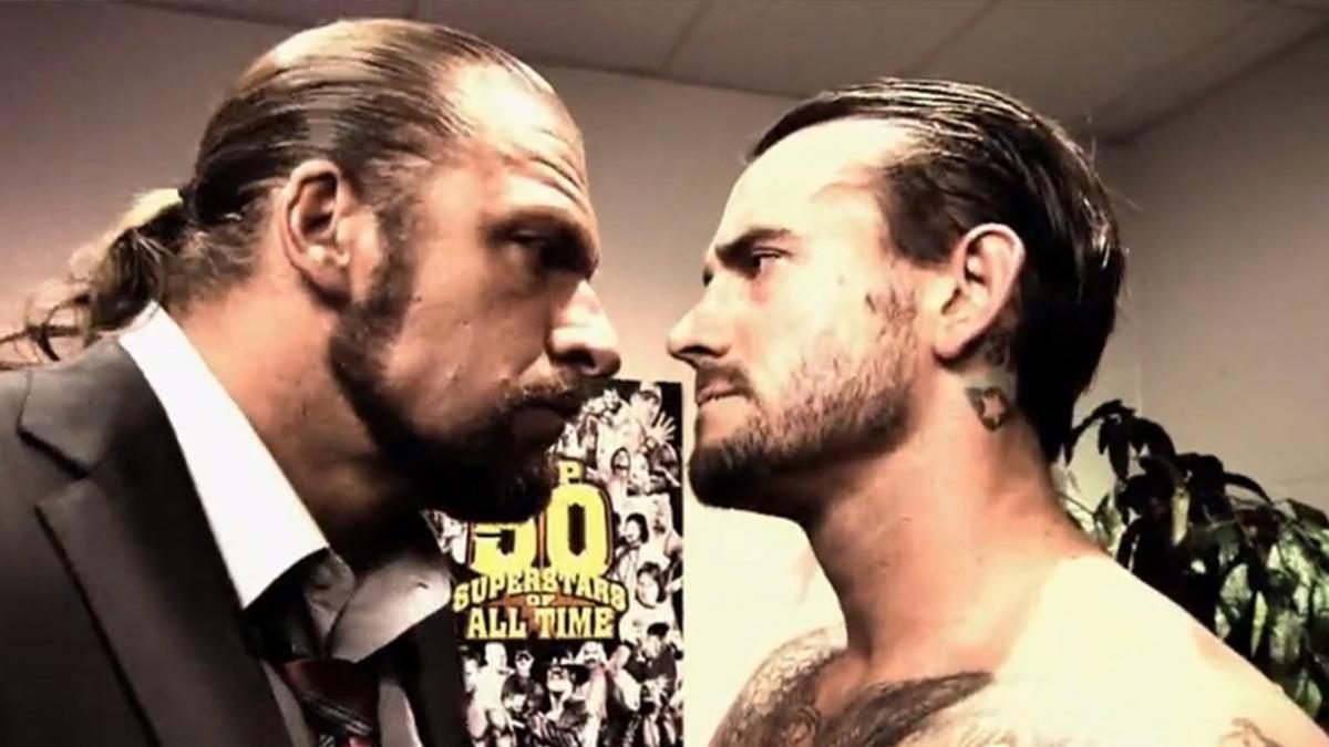 Triple H and CM Punk have a staredown