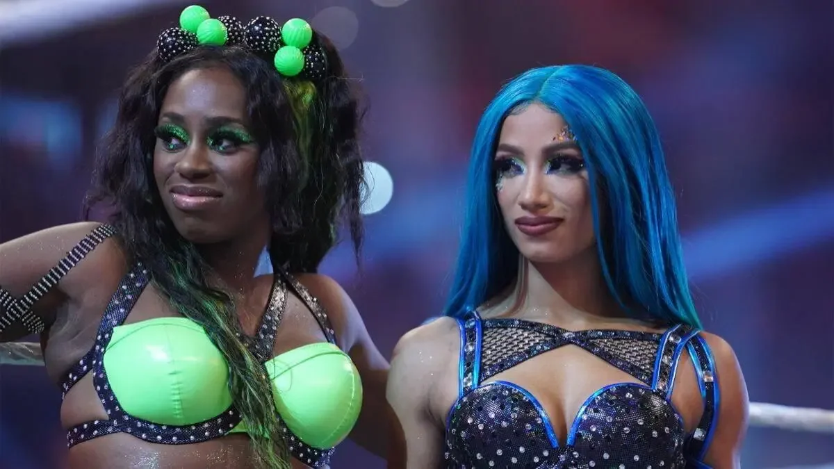 Naomi and Sasha Banks smiling together in the ring