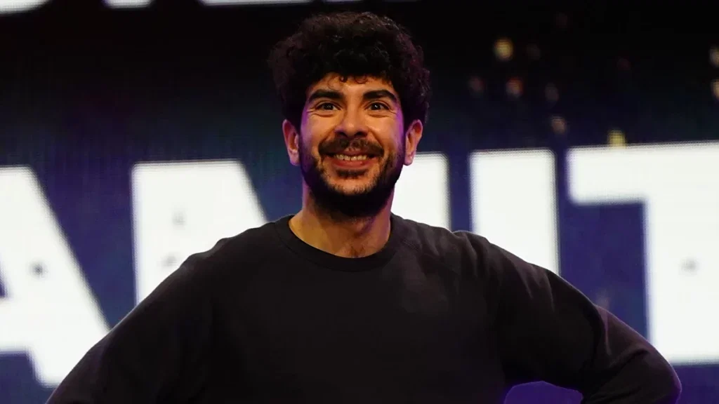 Tony Khan smiling.