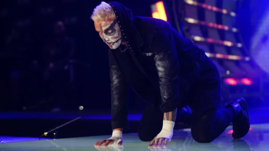 Darby Allin crouching during his entrance.