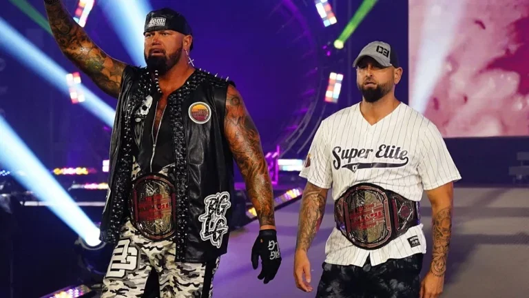 Doc Gallows and Karl Anderson wearing the IMPACT Tag Team Title belts.