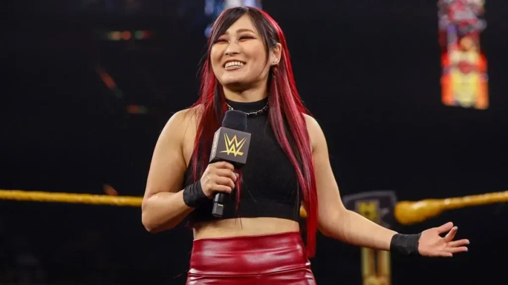 Io Shirai holding an NXT microphone