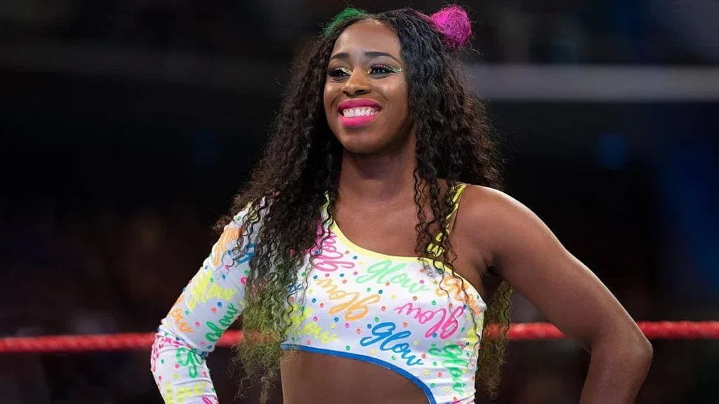 Naomi standing in a WWE Raw ring.