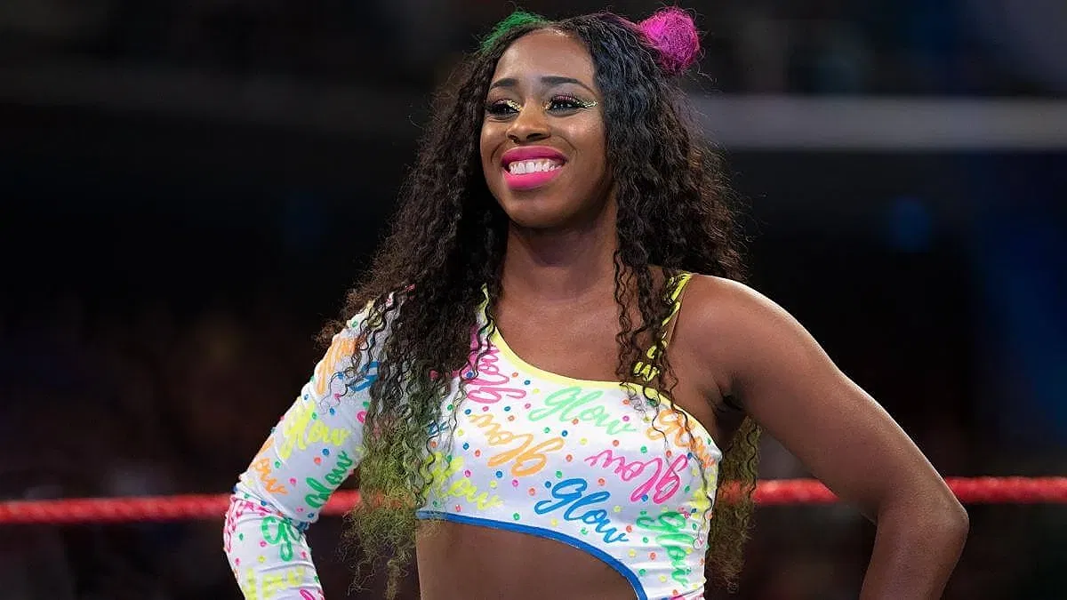 Naomi standing in a WWE Raw ring.