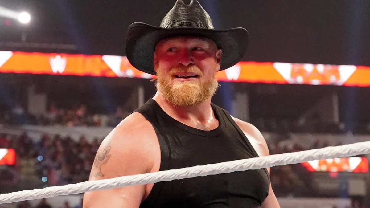 Brock Lesnar smiles in black cowboy hat and black tank top