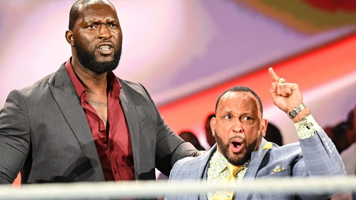 Omos and MVP angrily looking at their rivals in the ring