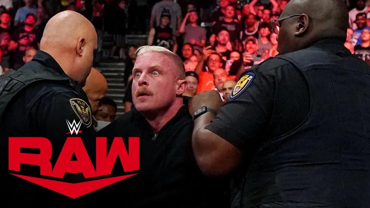 Dexter Lumis being escorted out by security on Raw