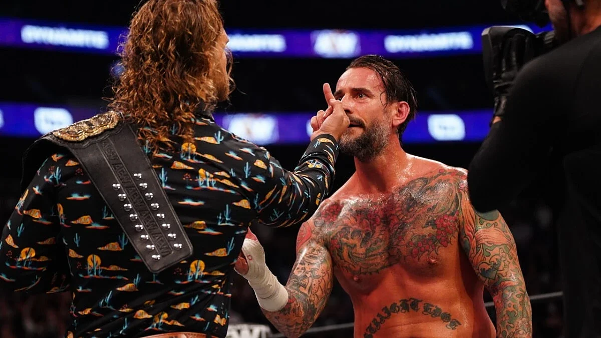 Hangman Page gives CM Punk the middle finger
