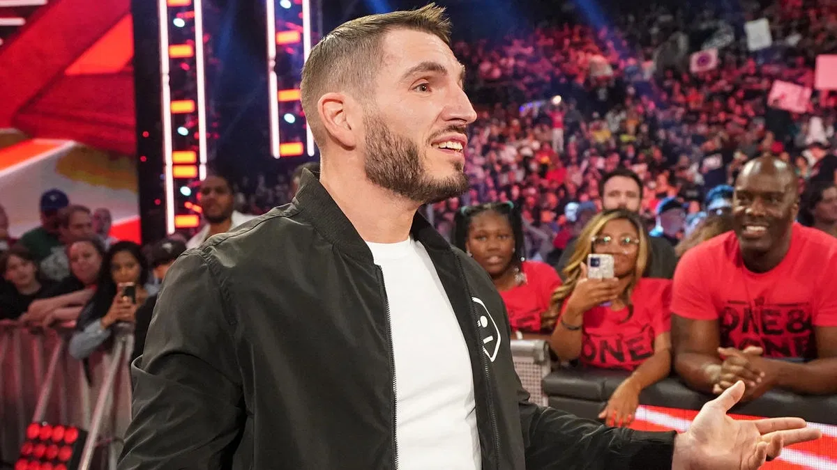 Johnny Gargano smiling after laying out Theory