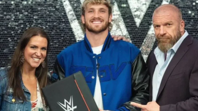 Logan Paul with Stephanie McMahon and Triple H