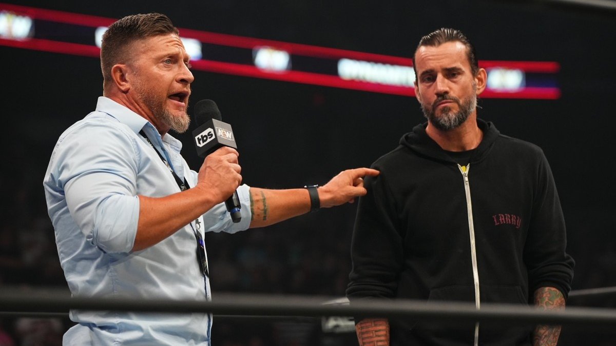 Ace Steel in the ring with CM Punk, who he trained