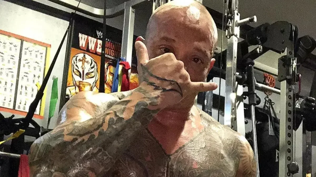 A recent photo of Rey Mysterio unmasked in the gym