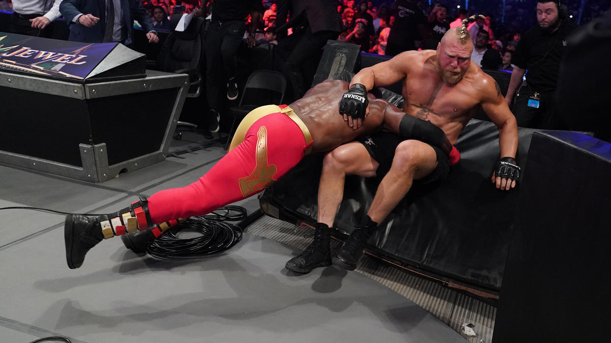 Bobby Lashley spearing Brock Lesnar through the barricade