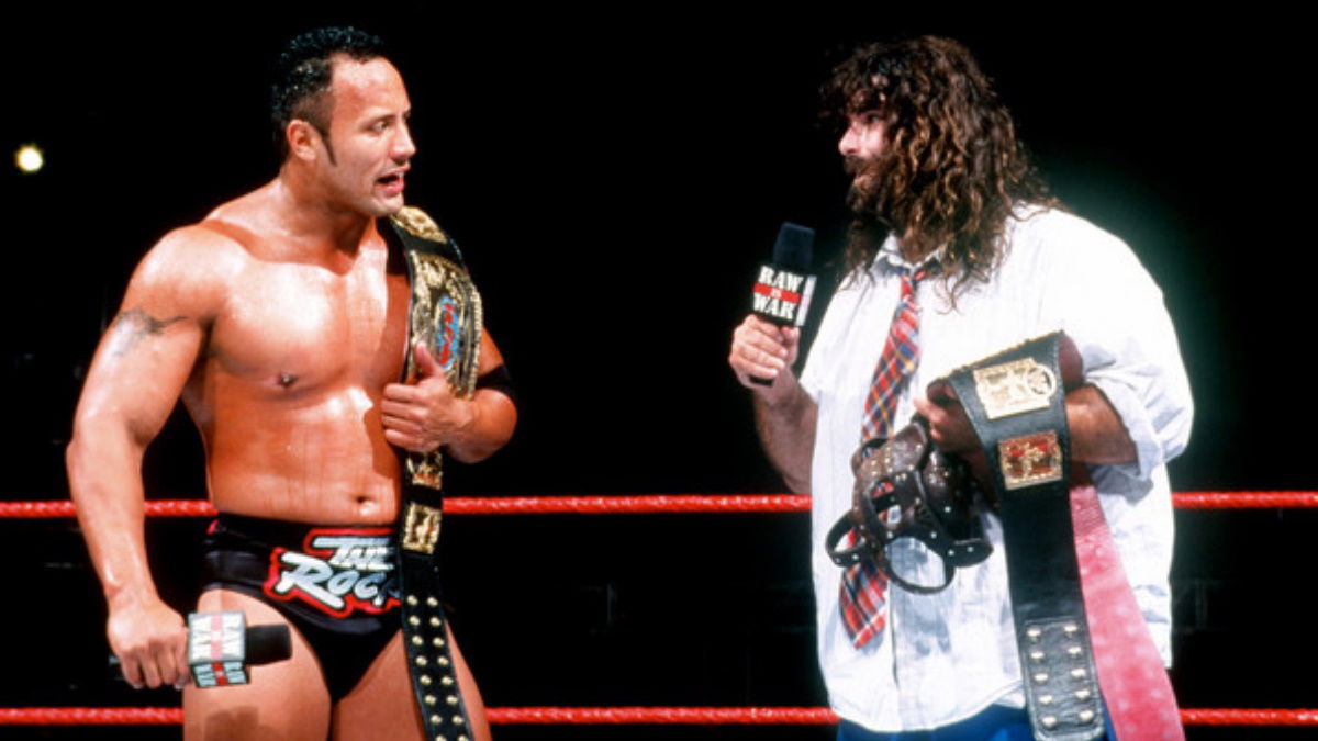 https://cdn.wrestletalk.com/wp-content/uploads/2022/12/The-Rock-Mankind-Mick-Foley-Rock-n-and-Sock-Connection.jpg