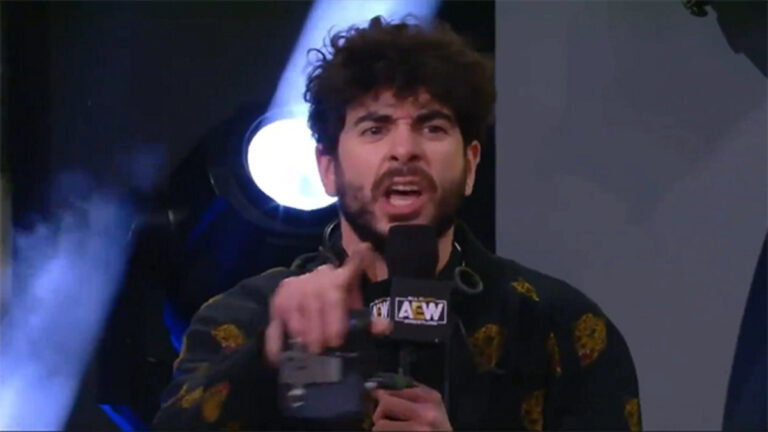 AEW CEO Tony Khan shouting angrily on the stage
