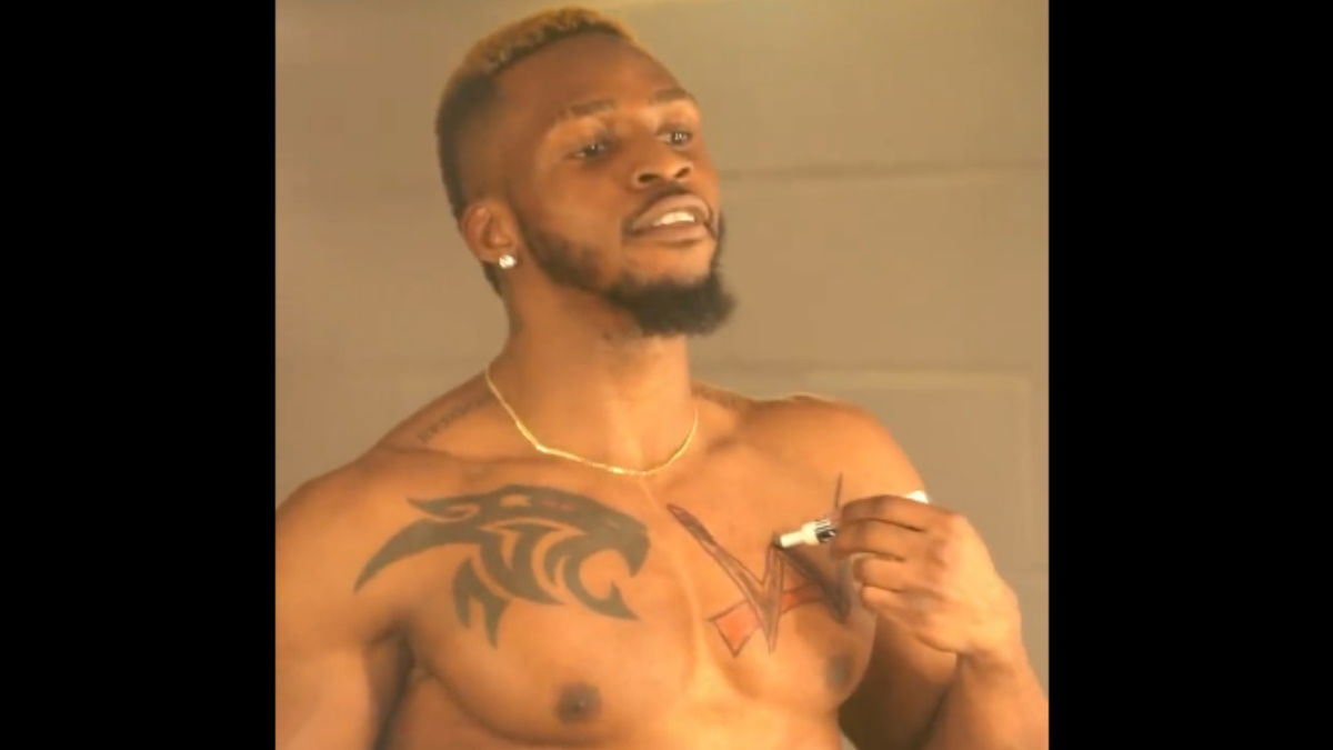 NXT Anonymous Footage Shows Edris Enofe FAKED WWE Logo Tattoo