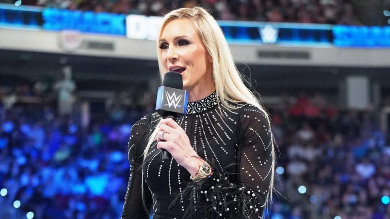 WWE star Charlotte Flair in ring with microphone