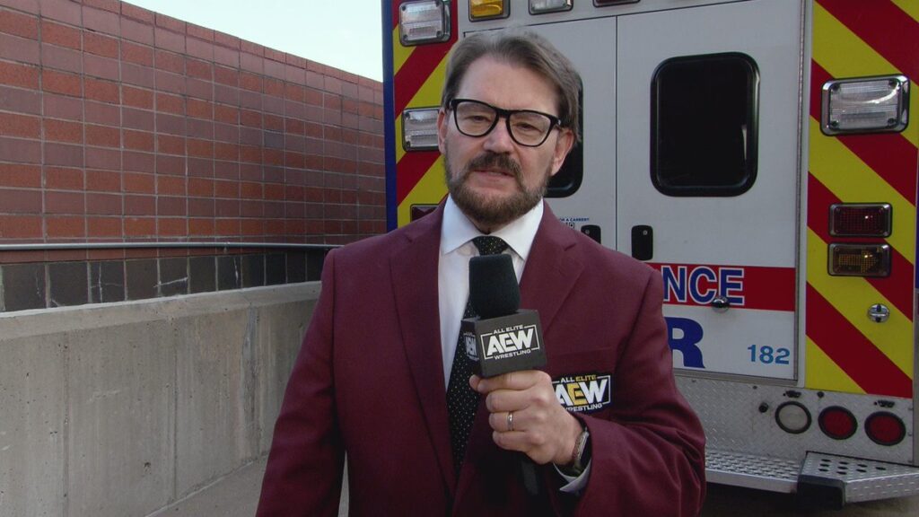 AEW Tony Schiavone in front of ambulance