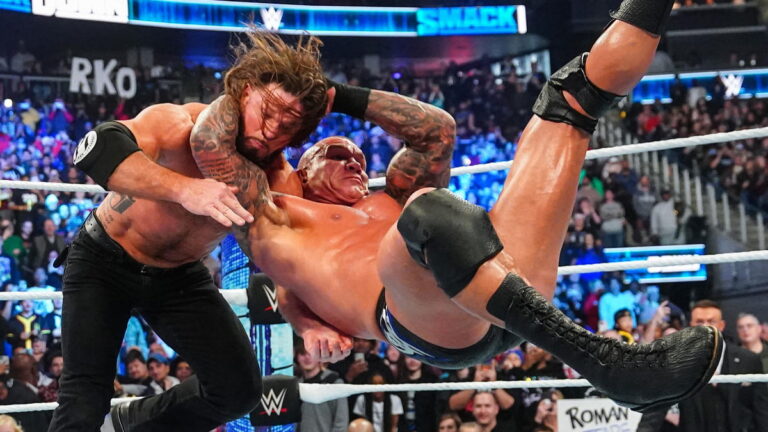 WWE star Randy Orton hitting AJ Styles with an RKO