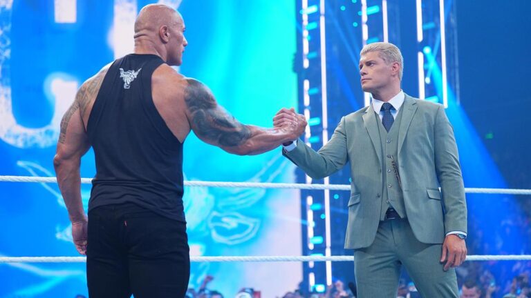 WWE stars The Rock and Cody Rhodes shaking hands
