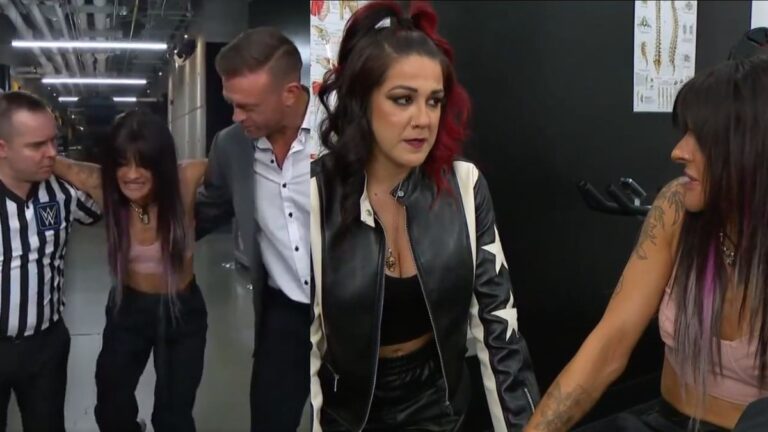 WWE stars Dakota Kai being helped by Nick Aldis and referee, backstage with Bayley