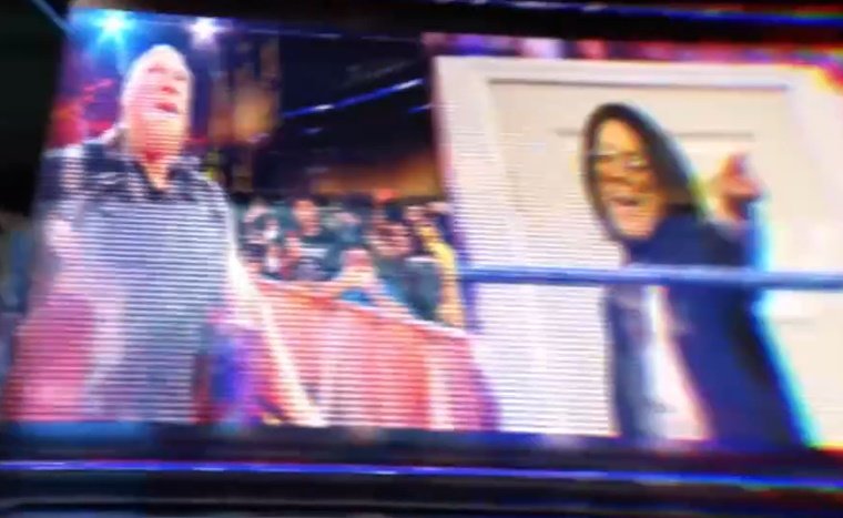 A shot of the WWE intro video featuring Brock Lesnar and Bayley