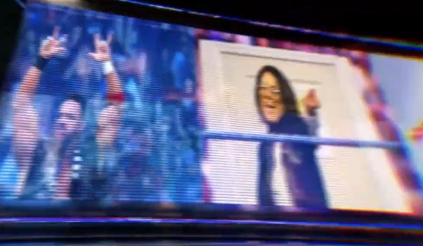 A shot of the WWE intro video featuring LA Knight and Bayley, with Knight having replaced Brock Lesnar