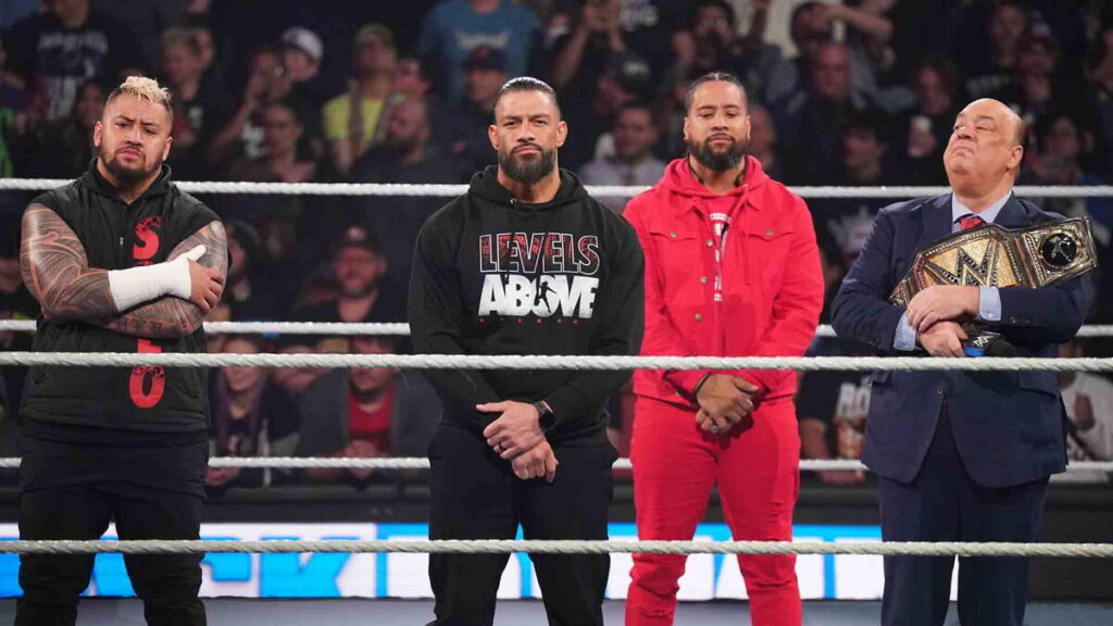 WWE SmackDown photo of the Bloodline Solo Sikoa Roman Reigns Jimmy Uso and Paul Heyman standing in the ring