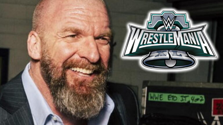 WWE CCO Triple H smiling along with WrestleMania 40 logo