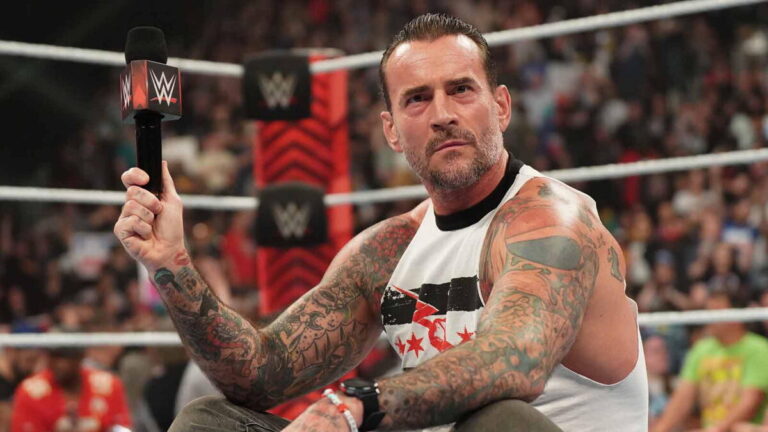 WWE CM Punk seated in the ring