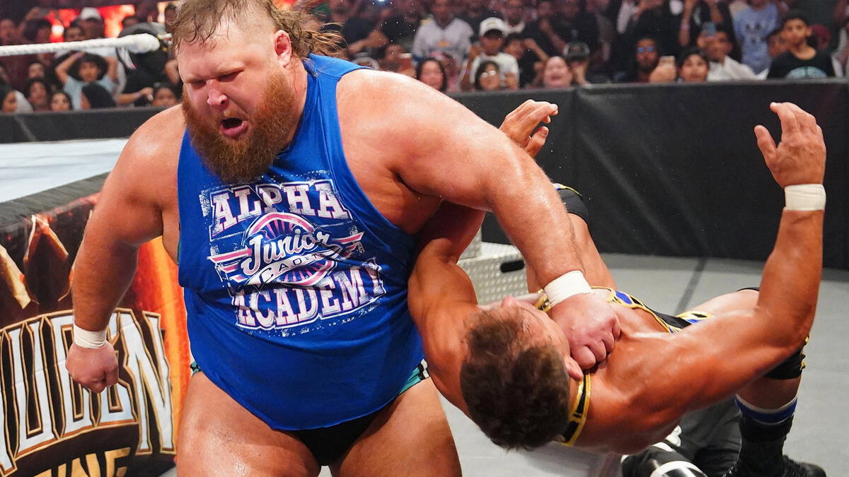 WWE star Otis clotheslining Chad Gable