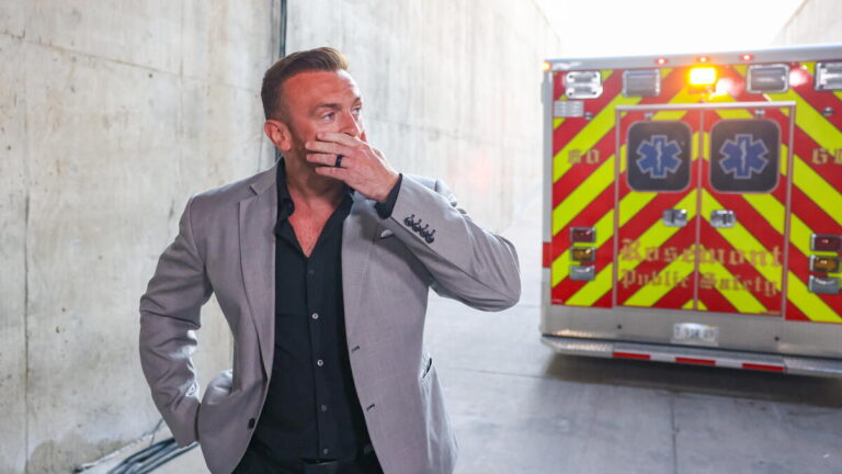 WWE GM Nick Aldis and an ambulance
