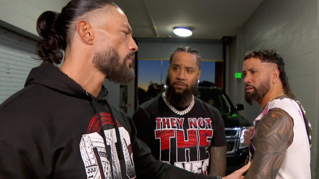 WWE SmackDown Roman Reigns face to face with Jey Uso with Jimmy Uso behind