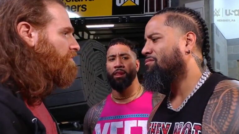 WWE stars Sami Zayn, Jimmy Uso and Jey Uso discussing the Bloodline