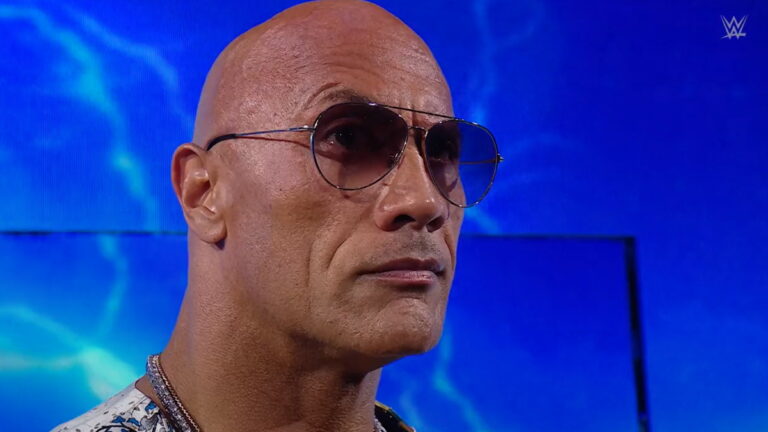 WWE Bad Blood 2024 closing moment featuring The Rock looking at Cody Rhodes and Roman Reigns