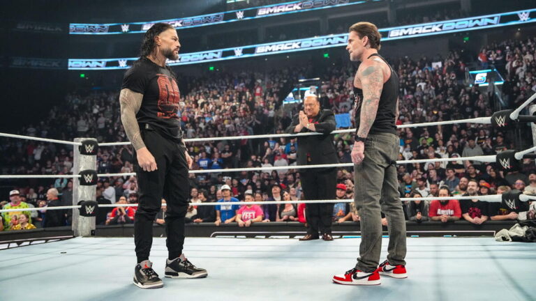 WWE Bloodline members Roman Reigns and Paul Heyman with CM Punk