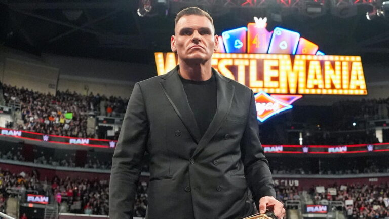 WWE World Heavyweight Champion GUNTHER in front of the WrestleMania 41 sign.