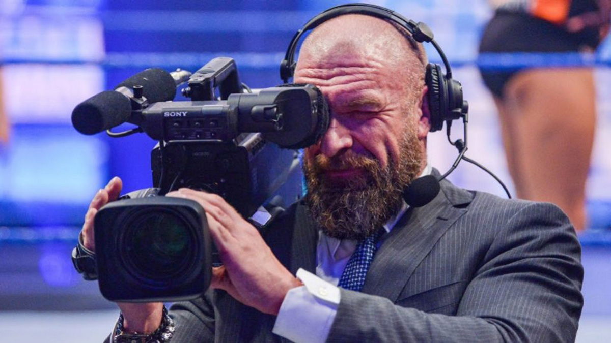 WWE CCO Triple H holding a camera