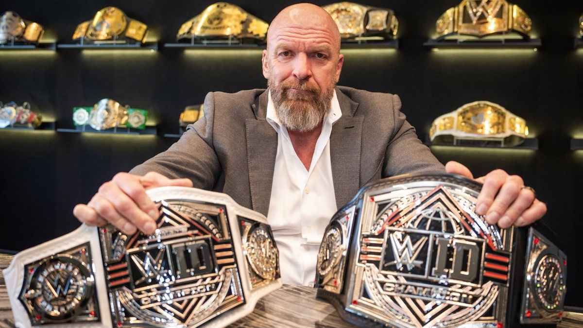 Triple H and the WWE ID Championship belts
