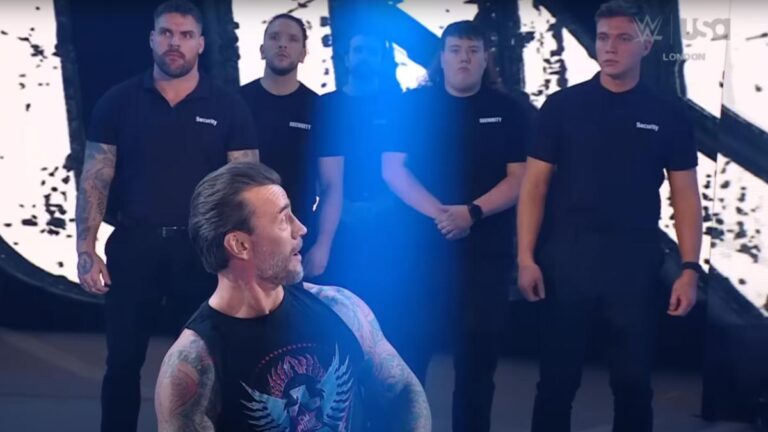 CM Punk looking at WWE security guards
