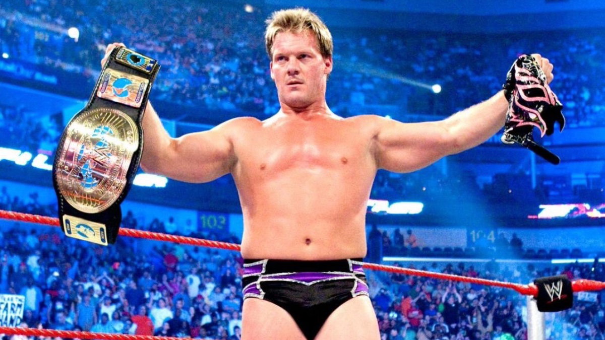 Chris Jericho with Rey Mysterio's mask and the WWE Intercontinental Title