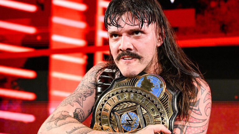 Dominik Mysterio with the WWE Intercontinental Championship