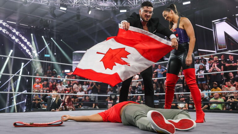 WWE stars Ethan Page and Chelsea Green with Canada flag