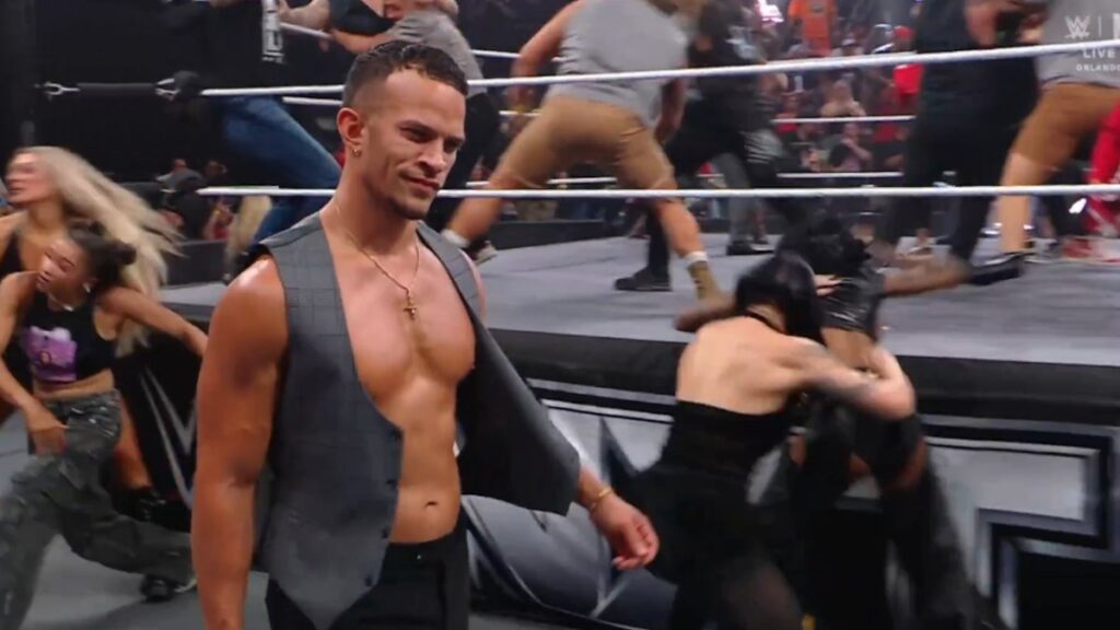 Ricky Saints walking past the TNA Invasion on WWE NXT