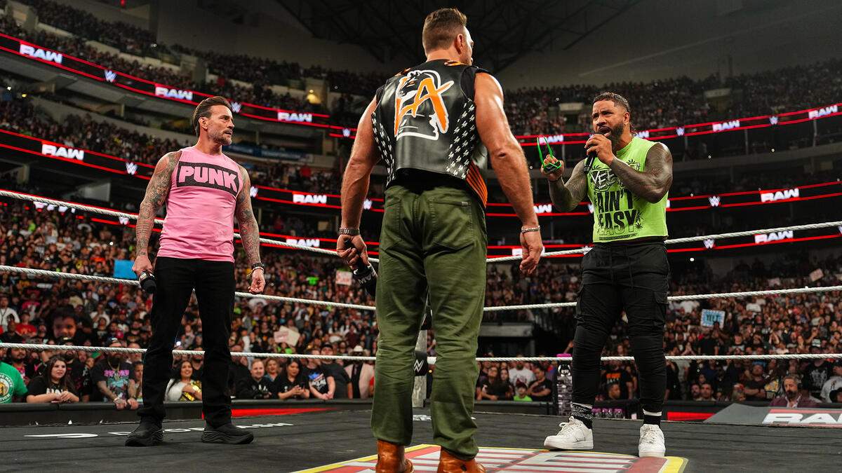 CM Punk and Jey Uso talking to LA Knight on WWE Raw