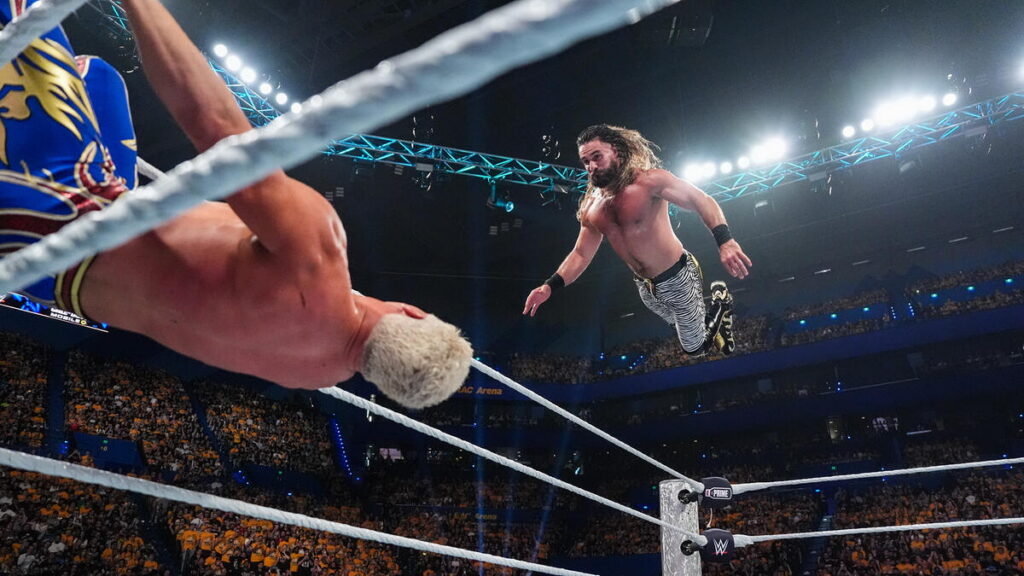 WWE's Seth Rollins hitting a Coast-To-Coast headbutt on Cody Rhodes