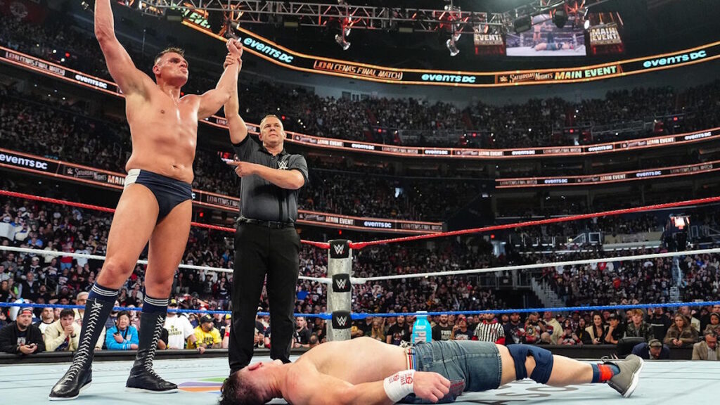 GUNTHER Standing over John Cena at WWE SNME