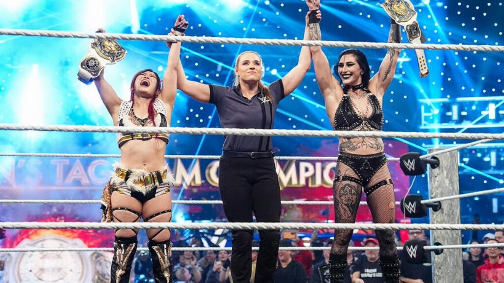 Rhea Ripley and IYO SKY celebrating their Women's Tag Title win on WWE Raw