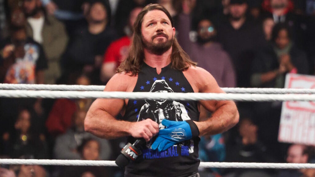 AJ Styles removing his gloves on WWE Raw