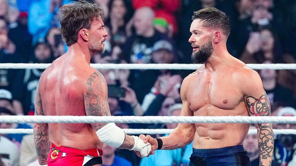 Finn Balor and CM Punk shake hands at WWE Elimination Chamber